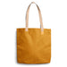 Bellroy City Tote - A mustard yellow tote bag with tan straps and a simple design. It features a logo on the front.