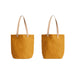 Bellroy City Tote - A yellow tote bag with tan straps, featuring a logo. Two angles displayed.