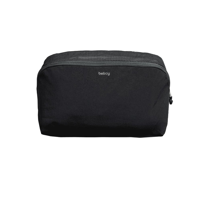Bellroy Lite Packing Cube 6L - A black packing cube with a mesh top and a logo, designed for organising travel essentials.