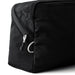 Bellroy Lite Packing Cube 6L - A black packing cube featuring a mesh panel and zip closure, designed for lightweight organisation.