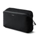 Bellroy Lite Packing Cube 6L - A black packing cube with a zippered mesh top, featuring branding on the front.