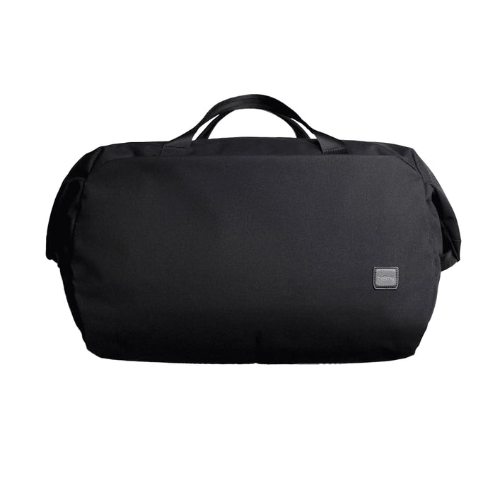 Bellroy Classic Duffel 45L - A black duffel bag with a logo and two top handles, designed for versatile travel or storage.
