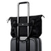 Bellroy Classic Tote - A black tote bag perched on top of a grey suitcase, featuring handles and a strap for carrying.