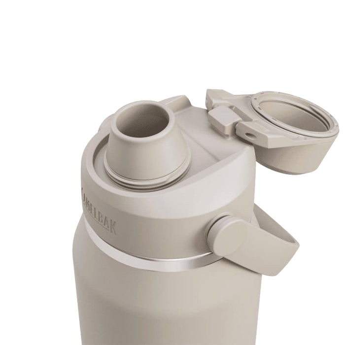 CamelBak - Thrive Chug VSS 1.0L - A drink bottle in a muted beige colour, featuring a wide mouth opening and a flip-top lid with a logo.