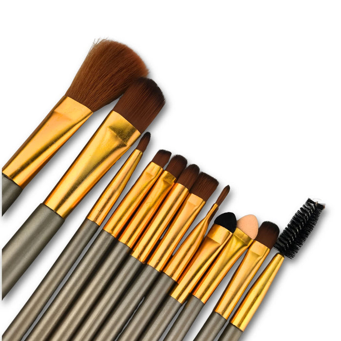 12-Piece Brush with Metal Box Set - A 12-piece brush set featuring various brushes with gold and silver handles in a metal box.