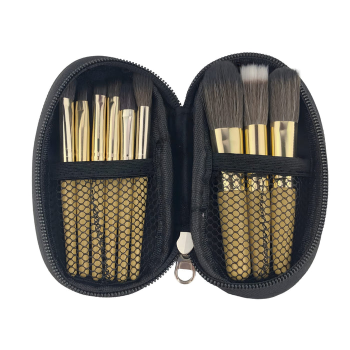 9 Brushes in a Case - A zippered case containing nine makeup brushes with gold handles and black bristles, neatly organised inside.