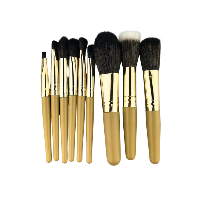 9 Brushes in a Case - A set of nine makeup brushes with gold handles and varying brush types, presented in a neat arrangement.