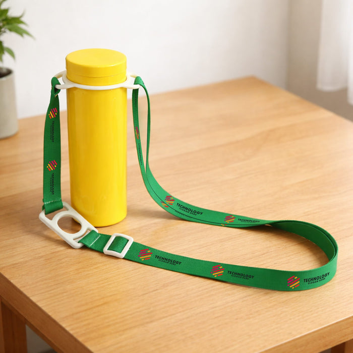 RPET 2 in 1 Water Bottle Lanyard - A drink bottle in yellow with a green lanyard attached, featuring logos, resting on a wooden surface.