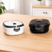 The Lunch Box 800ml - A lunch box set featuring a black and a white container, both with secure lids and separate compartments.