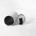 The Connor 600ml Vacuum Tumbler - A drink bottle with a silver exterior, a clear lid, and a reusable straw lies on a white surface.