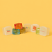 Jelly Cube Sensory Toy - Jelly Cube sensory toys in various colours, featuring a promotional logo on one cube against a bright yellow background.
