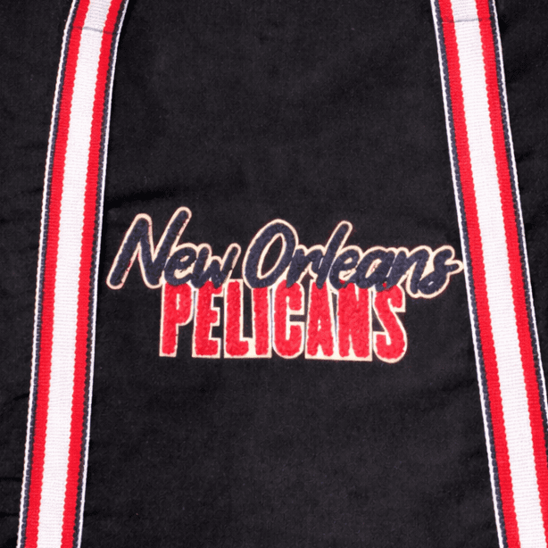 Century Canvas Tote Bag - A black tote bag featuring a logo and red and white striped straps.