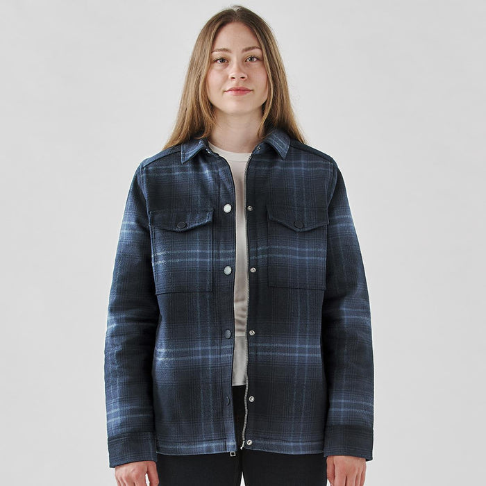 Women's Highland Sherpa Lined Plaid Jacket - A plaid jacket in navy and blue tones with a Sherpa lining and snap buttons. Features two chest pockets and a logo.