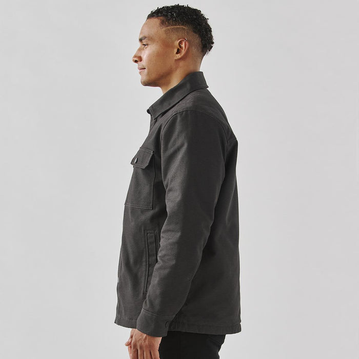 Men's Oxide Sherpa Lined Canvas Jacket - A men's dark grey canvas jacket featuring a Sherpa lining and a chest pocket, side view.