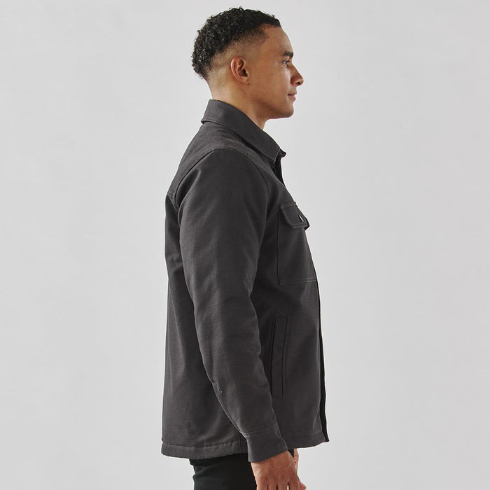 Men's Oxide Sherpa Lined Canvas Jacket - A men's black oxide Sherpa lined canvas jacket with a collar and side pocket, shown from a profile view.