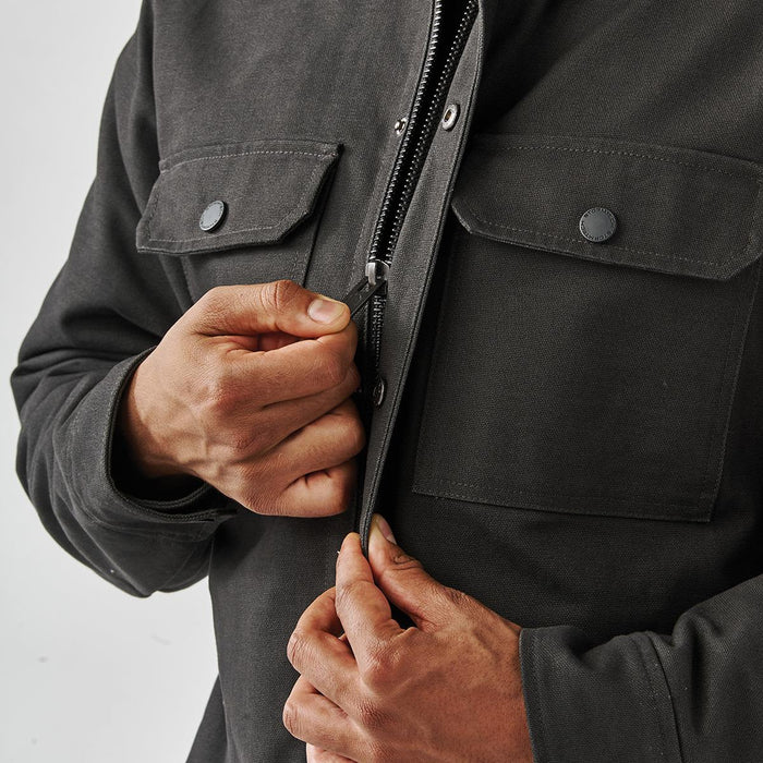 Men's Oxide Sherpa Lined Canvas Jacket - A men's dark grey oxide sherpa-lined canvas jacket with front pockets and a zipped closure.