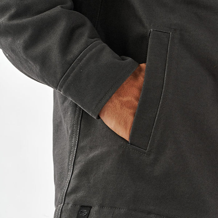 Men's Oxide Sherpa Lined Canvas Jacket - A men's oxford grey canvas jacket with a sherpa lining and side pocket detail. Features a branding tag.