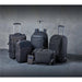 Road Warrior Computer Pack - A collection of black bags, including backpacks, a wheeled suitcase, and a messenger bag, with a sleek design.