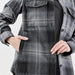 Women's Highland Plaid Shacket - A women's shacket in grey and black Highland plaid with a front pocket and button closure. Features a logo.