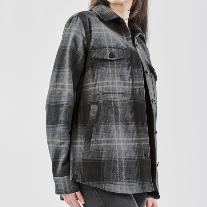 Women's Highland Plaid Shacket - A women's Highland plaid shacket in black and grey, featuring a button-up front and two chest pockets.
