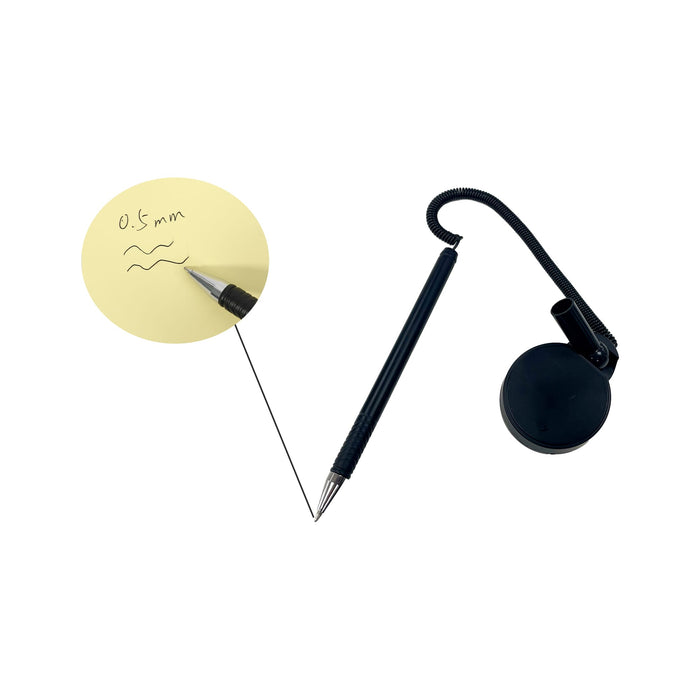 Counter Fixed Signature Pen D - A black fixed signature pen with a coiled cord, attached to a round base, beside a note with handwritten text.