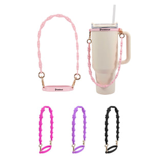 Silicone Flower Tumbler Strap - A drink bottle with a light pink silicone flower tumbler strap. Additional straps in pink, purple, and black are displayed.
