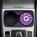 Air Freshener – Lavender - A round lavender air freshener sits in a car cup holder, featuring a logo in the centre.
