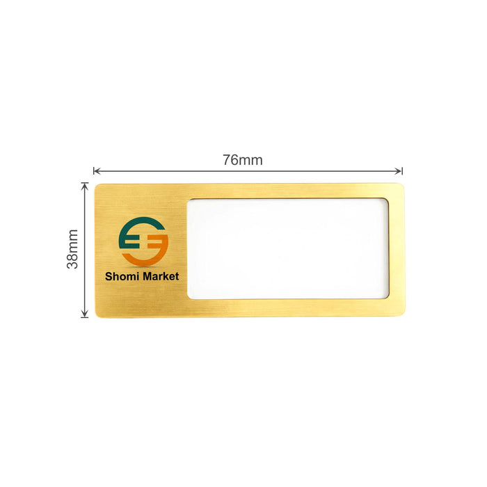 Reusable Metal Name Badge - A reusable metal name badge in gold with a clear window and a logo. Dimensions are 76mm by 38mm.