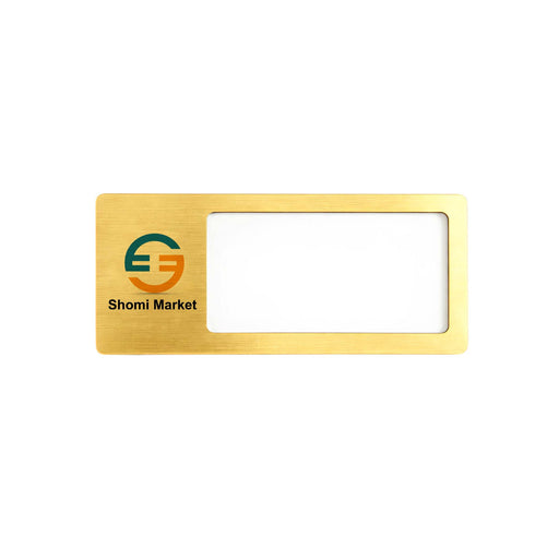 Reusable Metal Name Badge - A rectangular reusable metal name badge in gold with a window for a name and a logo in the corner.