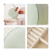 Small Portable PU Leather Jewellery Box - A small, round mint green PU leather jewellery box with a snap closure and an interior compartment for rings.