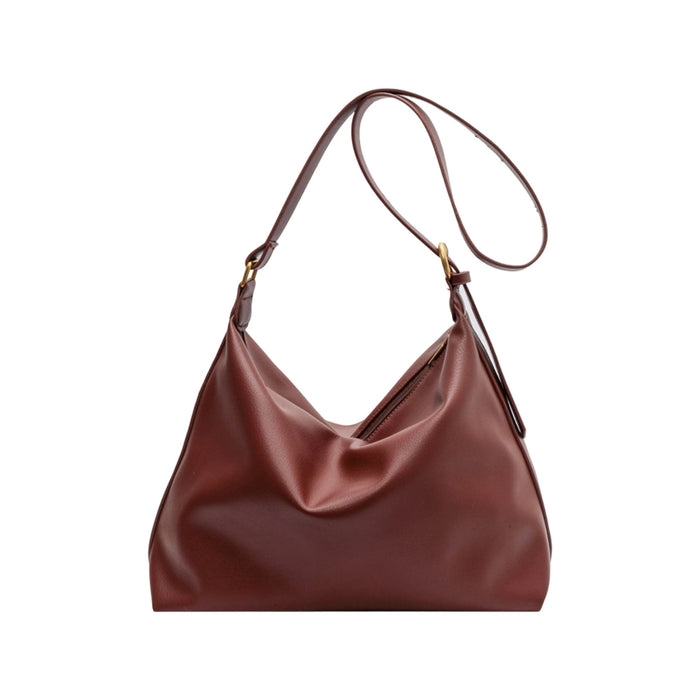 Dumpling Polyurethane Tote Bag - A brown polyurethane tote bag with a slouchy design and a long shoulder strap. It features a small logo.
