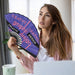 8inch Bamboo Fabric Hand Fan - A bamboo fabric hand fan in purple and black, featuring graphic design elements, held by a woman near a laptop.