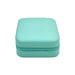 PU Leather Jewellery Box - A turquoise PU leather jewellery box with a zippered closure and a textured finish. It features a logo on the surface.