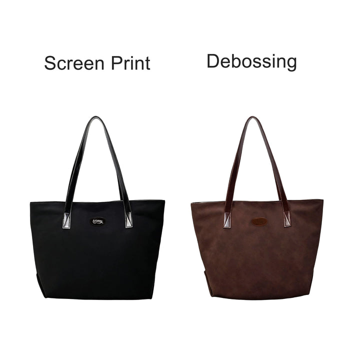 Suede Leather Tote Bag - A black tote bag with a shiny finish and a brown suede leather tote bag, both featuring a logo.
