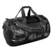 Stormtech Gear Bag Large - A large black duffle bag with sturdy handles and adjustable straps, featuring a logo.