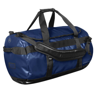 Stormtech Gear Bag Large - A large navy blue duffle bag with black straps and a branding logo.