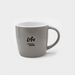 The Maxwell 330ml Ceramic Mug - A ceramic mug in light grey featuring a handle and a logo on the front.