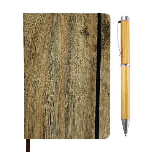 Wood Look Notebook and Pen Gift Set - A wood look notebook with a black elastic band, next to a bamboo pen featuring a silver tip.