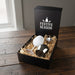 Bella Stainless Steel Wine Glas - A gift box containing a white egg and a stainless steel wine glass, resting on straw. The box has a festive design.
