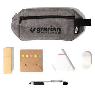 Stationary Essentials Pack - A grey pencil case with a logo contains sticky notes, a triangular notepad, a white eraser, and a black pen.