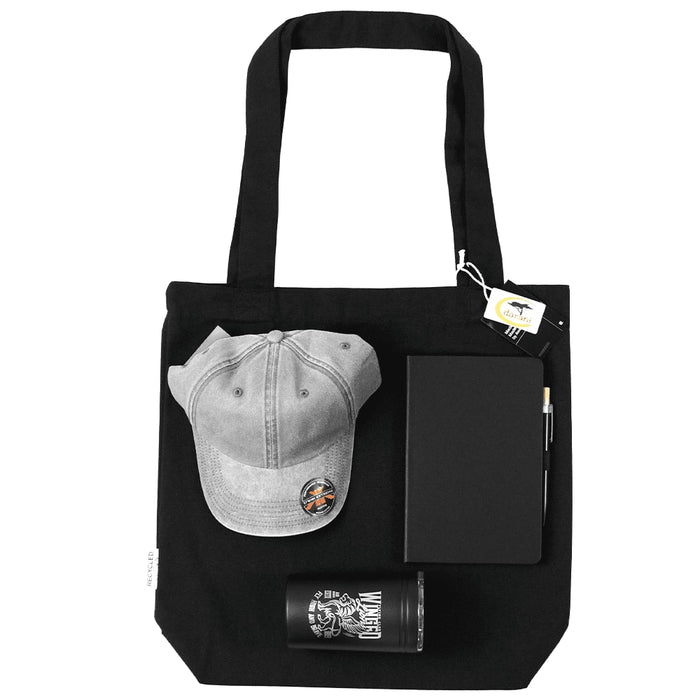 Lifestyle Essentials Pack - A black tote bag containing a grey cap, a notebook, a pen, and a glass tumbler.