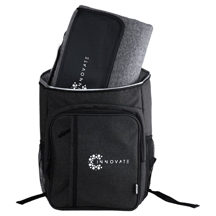 Picnic Pack - A black backpack with a large compartment containing a grey picnic blanket and an emblem on the front.