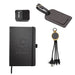 The Custom Travel Kit - A black notebook, a luggage tag, a charging cable with multiple connectors, and a power bank, all featuring branding.