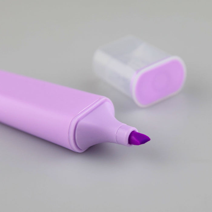 Luxer Highlighter - A purple highlighter with a chisel tip and a translucent cap placed nearby. The product has a smooth, sleek design.