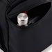 High Sierra Travel Duffel - A black travel duffel featuring a zippered pocket with a silver drink bottle and a phone inside.