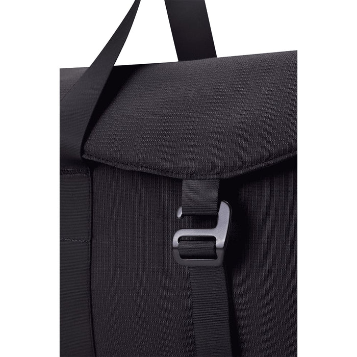 High Sierra Camille Duffel 31L - A black duffel bag with a textured finish and a clasp closure, featuring a strap for carrying.