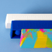 30cm Popper Ruler - Three popper rulers in vibrant colours: a white ruler, a blue ruler, and a multicoloured patterned ruler, stacked together.