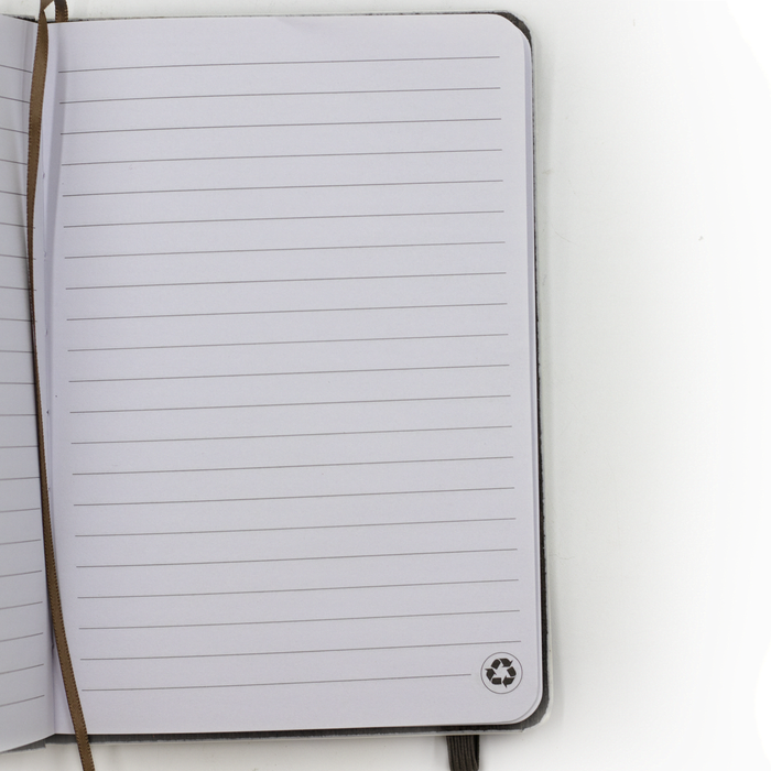 The Barker Eco Notebook - B6 - An open notebook with lined pages and a logo in the bottom corner. The cover is a neutral colour.