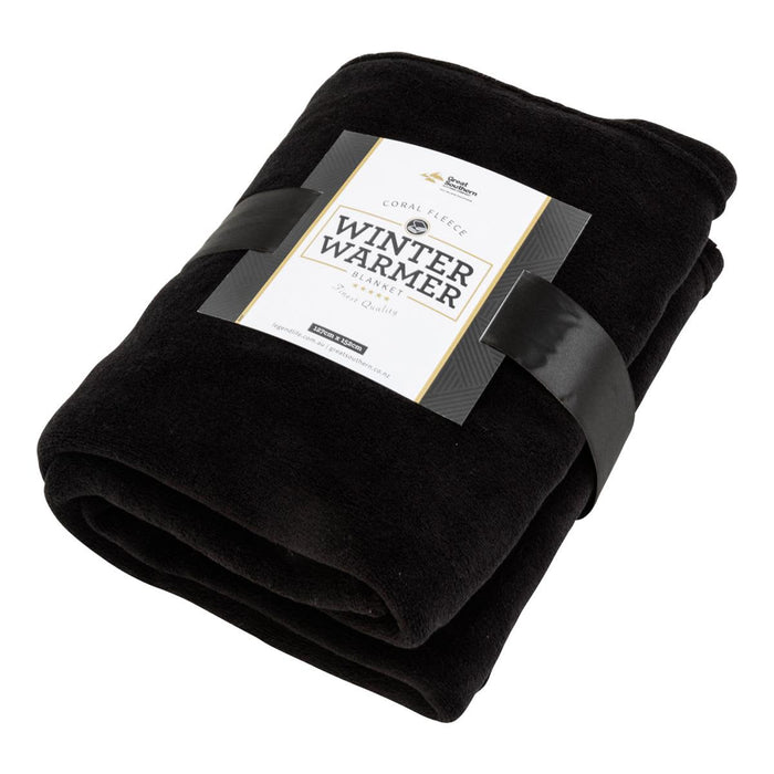 Coral Fleece Blanket - A black Coral Fleece blanket wrapped with a band featuring branding, showcasing its soft texture and warmth.