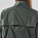 Women's Pacifica Full Zip Jacket - A dark green women's rain jacket featuring a high collar and back flap detail, with branding visible.